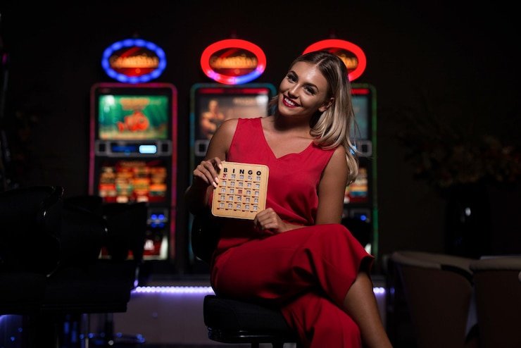 Professional live dealer at a blackjack table in an HD studio